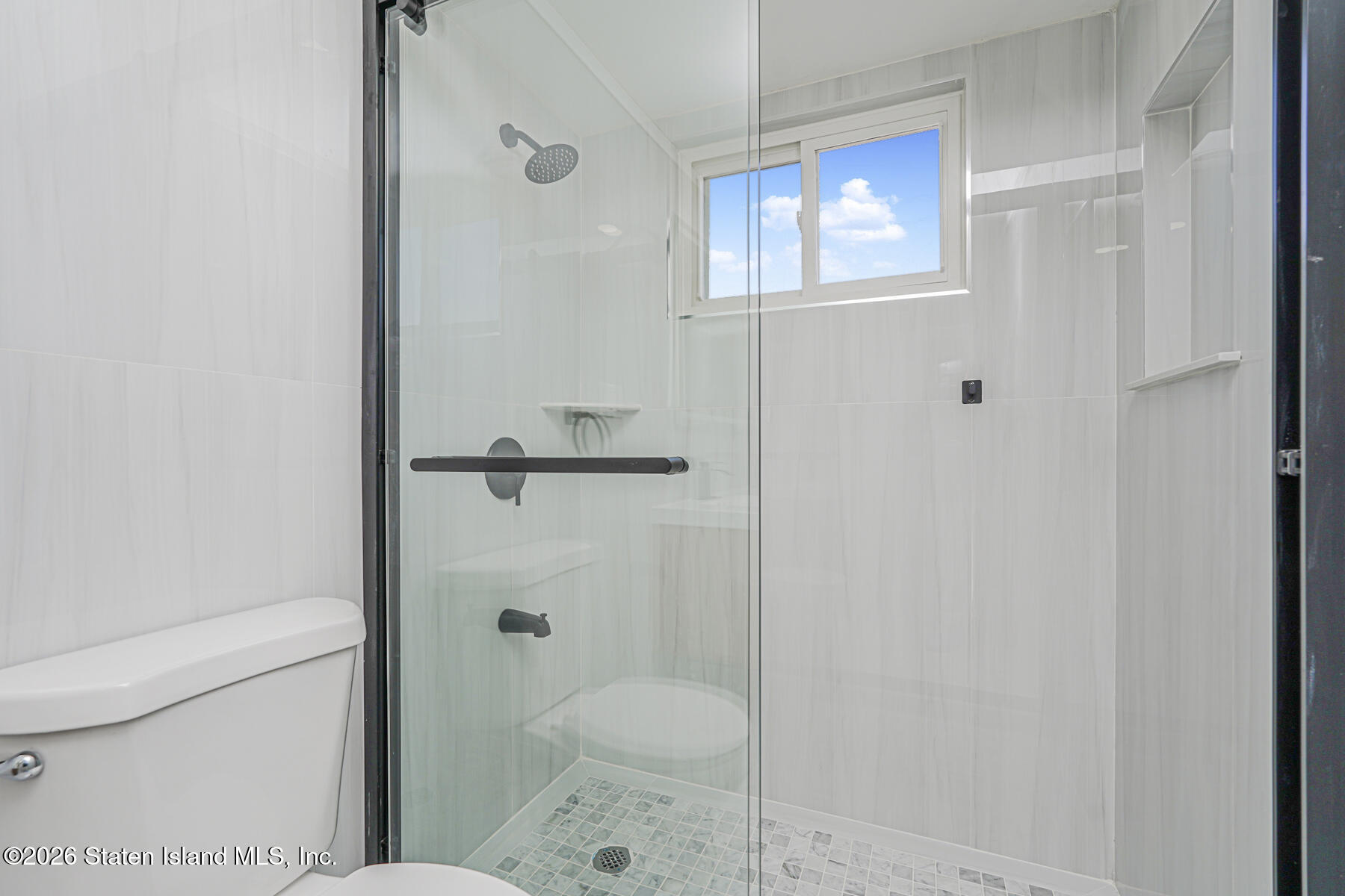 39 Commerce Street Staten Island, NY 10314 - Photo 20 of 49 a bathroom with a shower and toilet