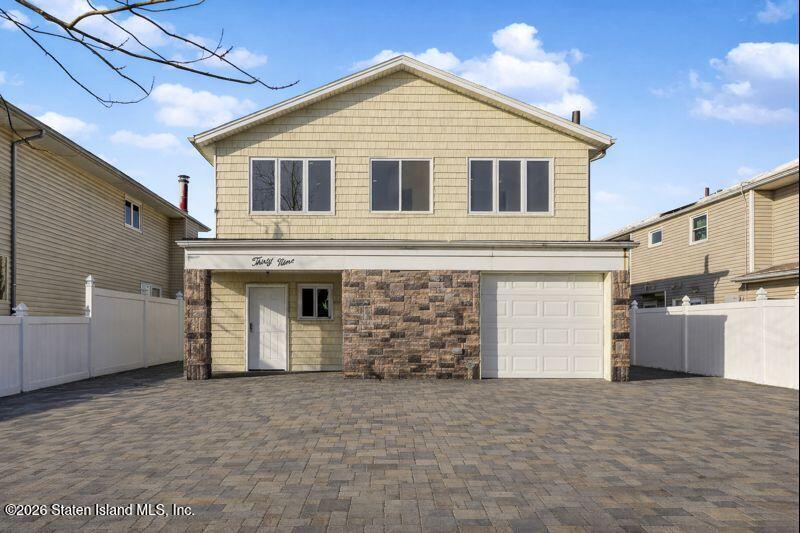 39 Commerce Street Staten Island, NY 10314 - Photo 2 of 49 a view of a house with a yard