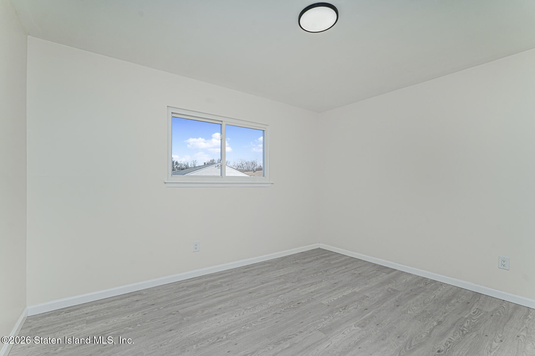 39 Commerce Street Staten Island, NY 10314 - Photo 28 of 49 wooden floor in an empty room