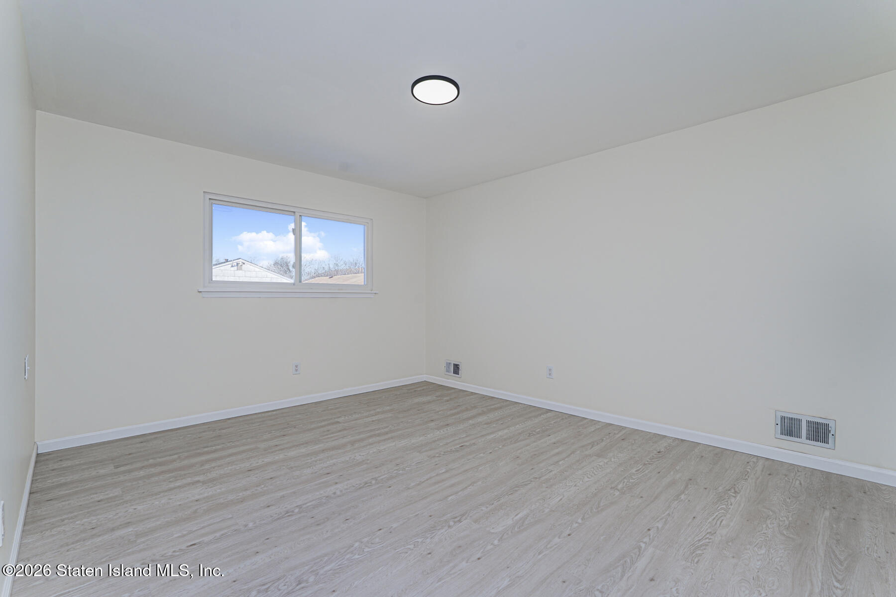 39 Commerce Street Staten Island, NY 10314 - Photo 30 of 49 wooden floor in an empty room