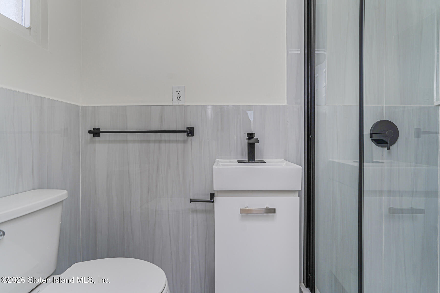 39 Commerce Street Staten Island, NY 10314 - Photo 32 of 49 a bathroom with a toilet and a shower