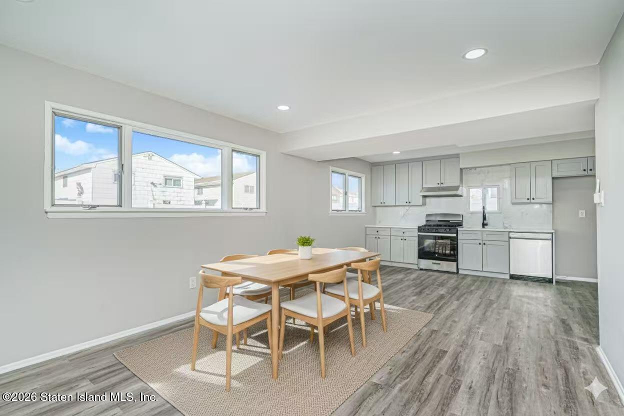 39 Commerce Street Staten Island, NY 10314 - Photo 35 of 49 a view of a dining room with furniture and wooden floor