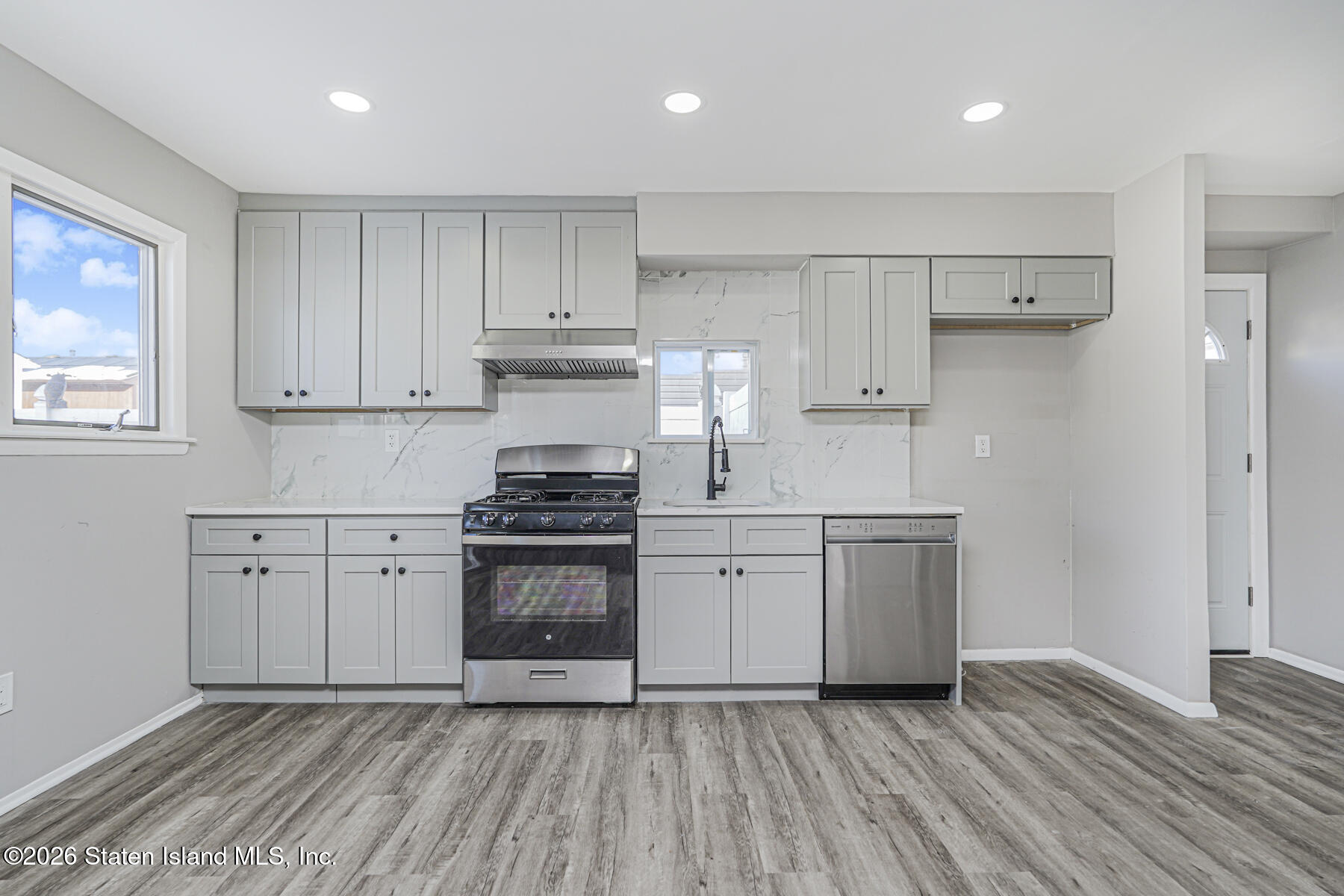 39 Commerce Street Staten Island, NY 10314 - Photo 40 of 49 a kitchen with stainless steel appliances granite countertop a stove a sink and a refrigerator