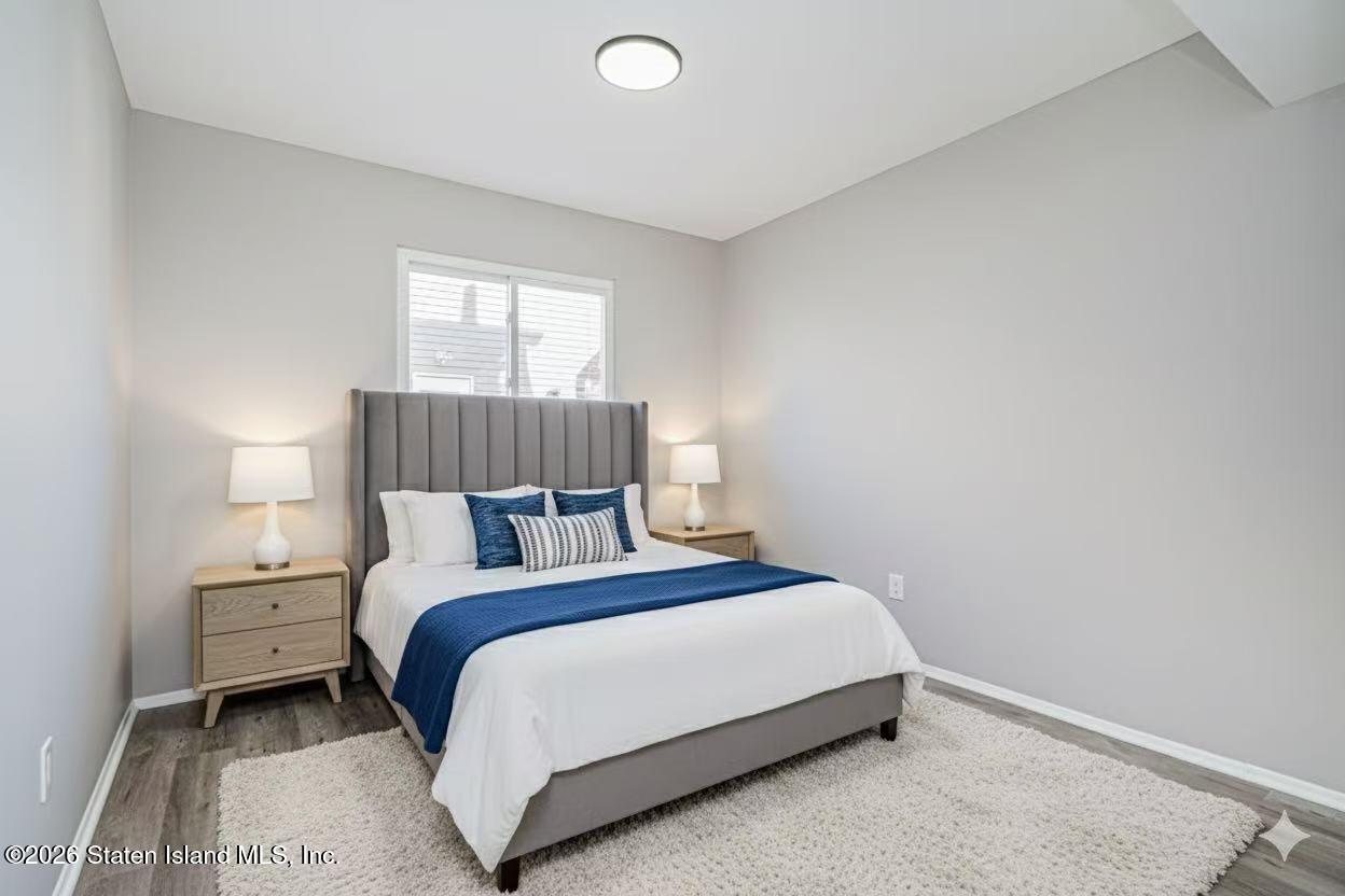 39 Commerce Street Staten Island, NY 10314 - Photo 44 of 49 a bedroom with a bed and window