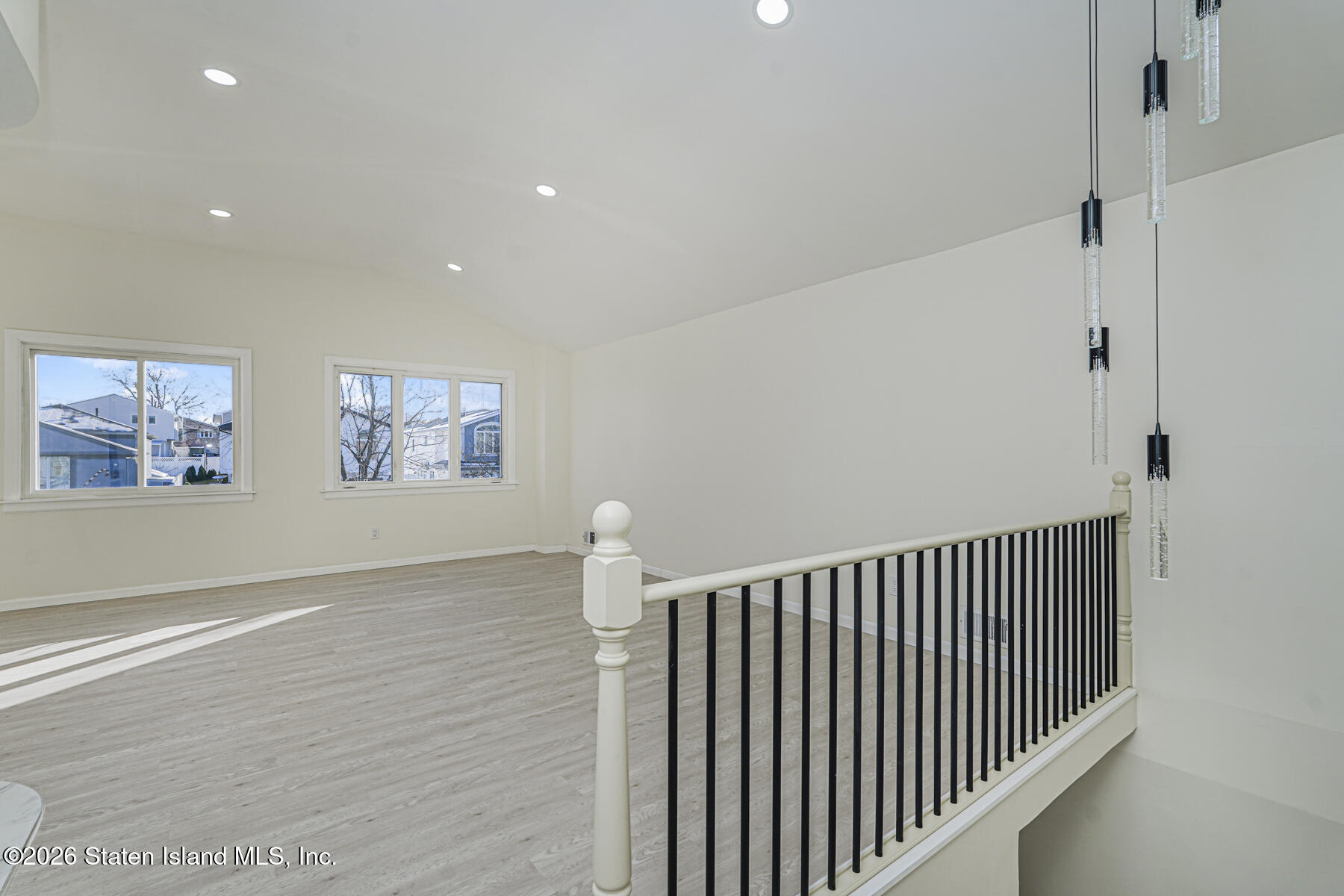 39 Commerce Street Staten Island, NY 10314 - Photo 5 of 49 a view of staircase with railing and white walls