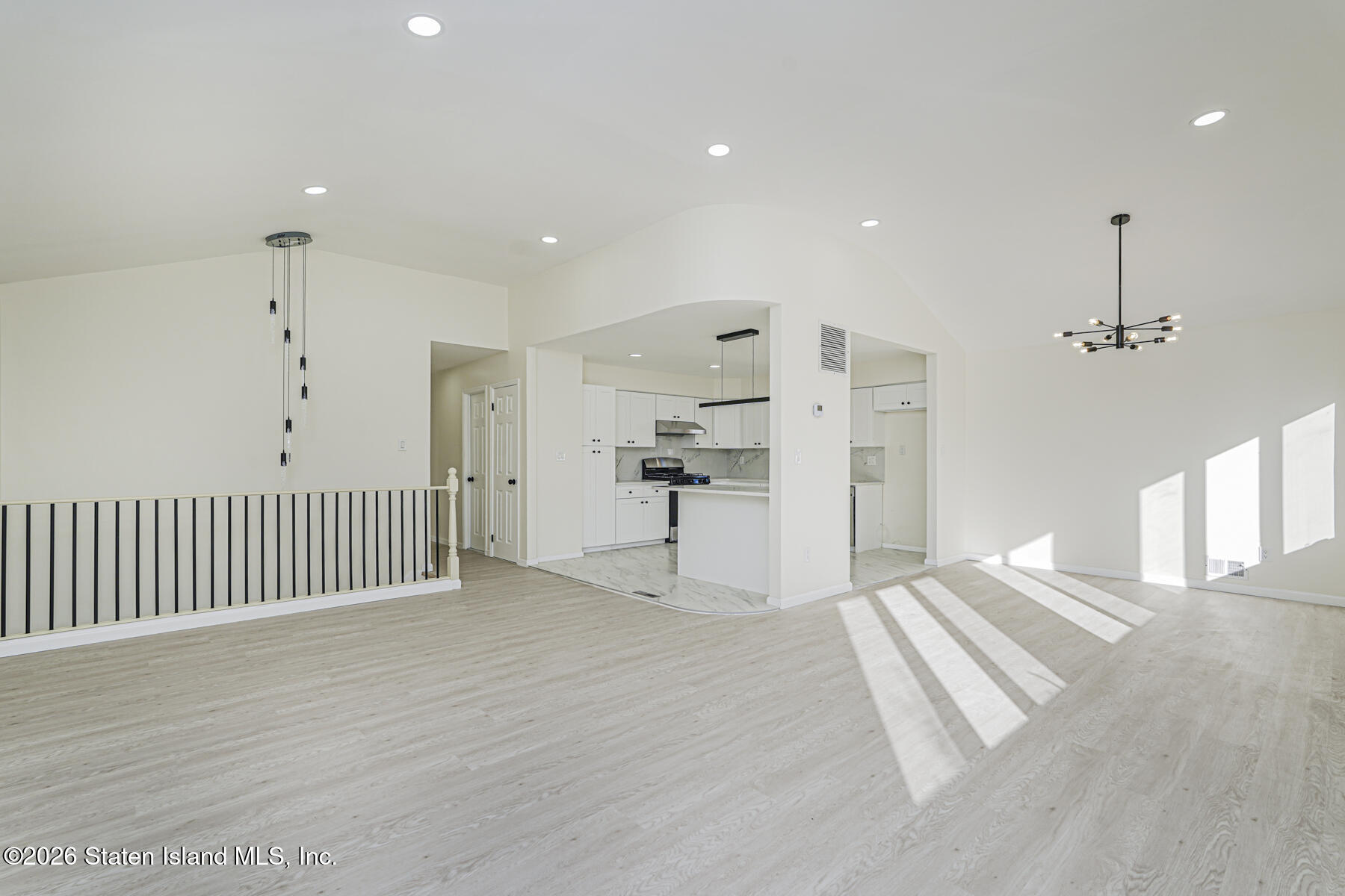 39 Commerce Street Staten Island, NY 10314 - Photo 7 of 49 a view of empty room with wooden floor and windows