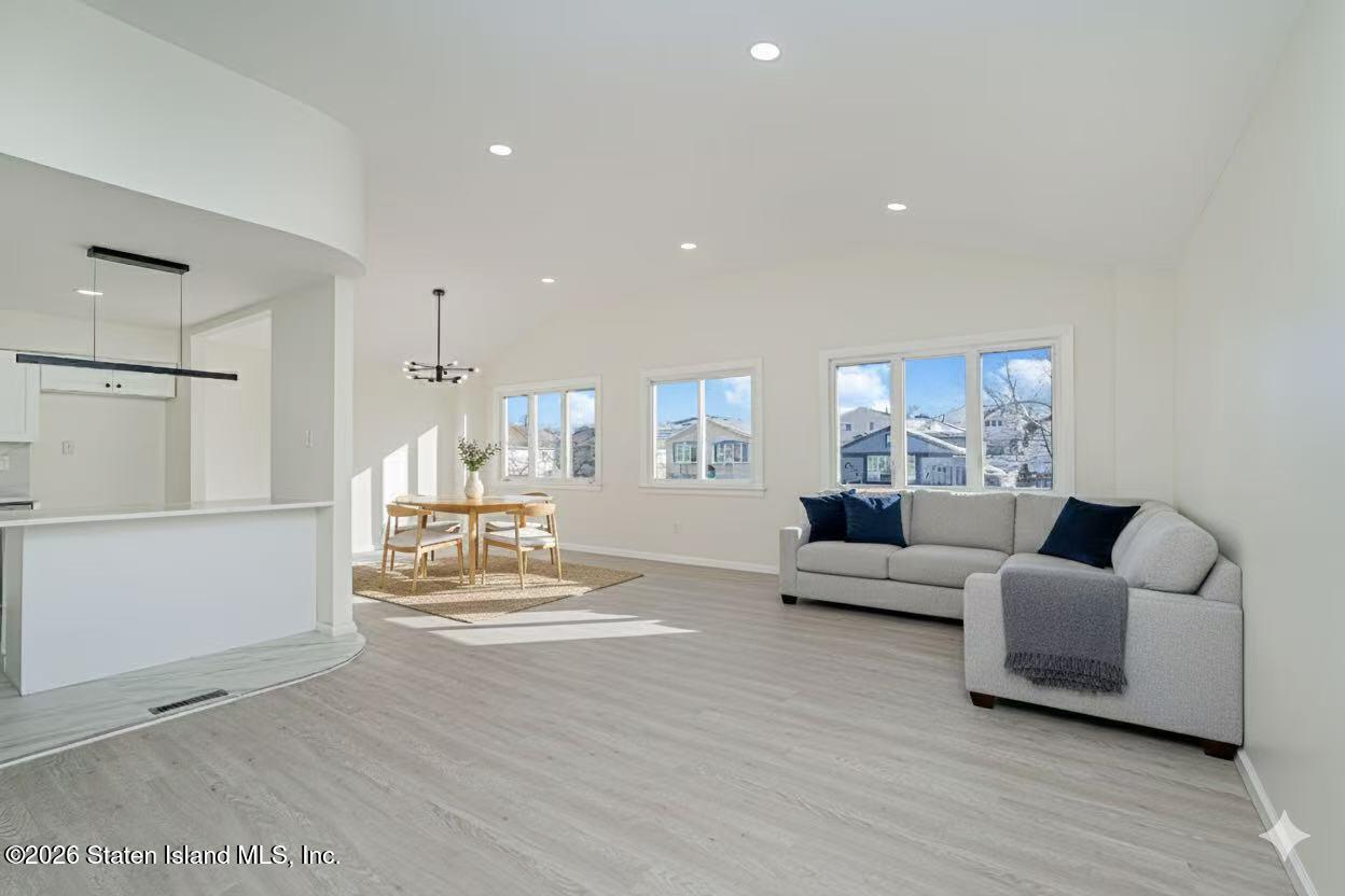39 Commerce Street Staten Island, NY 10314 - Photo 10 of 49 a living room with furniture and a table