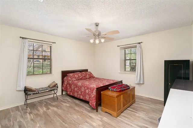 a bedroom with a bed and a tv