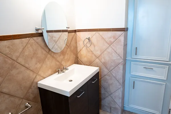 a bathroom with a sink and a mirror