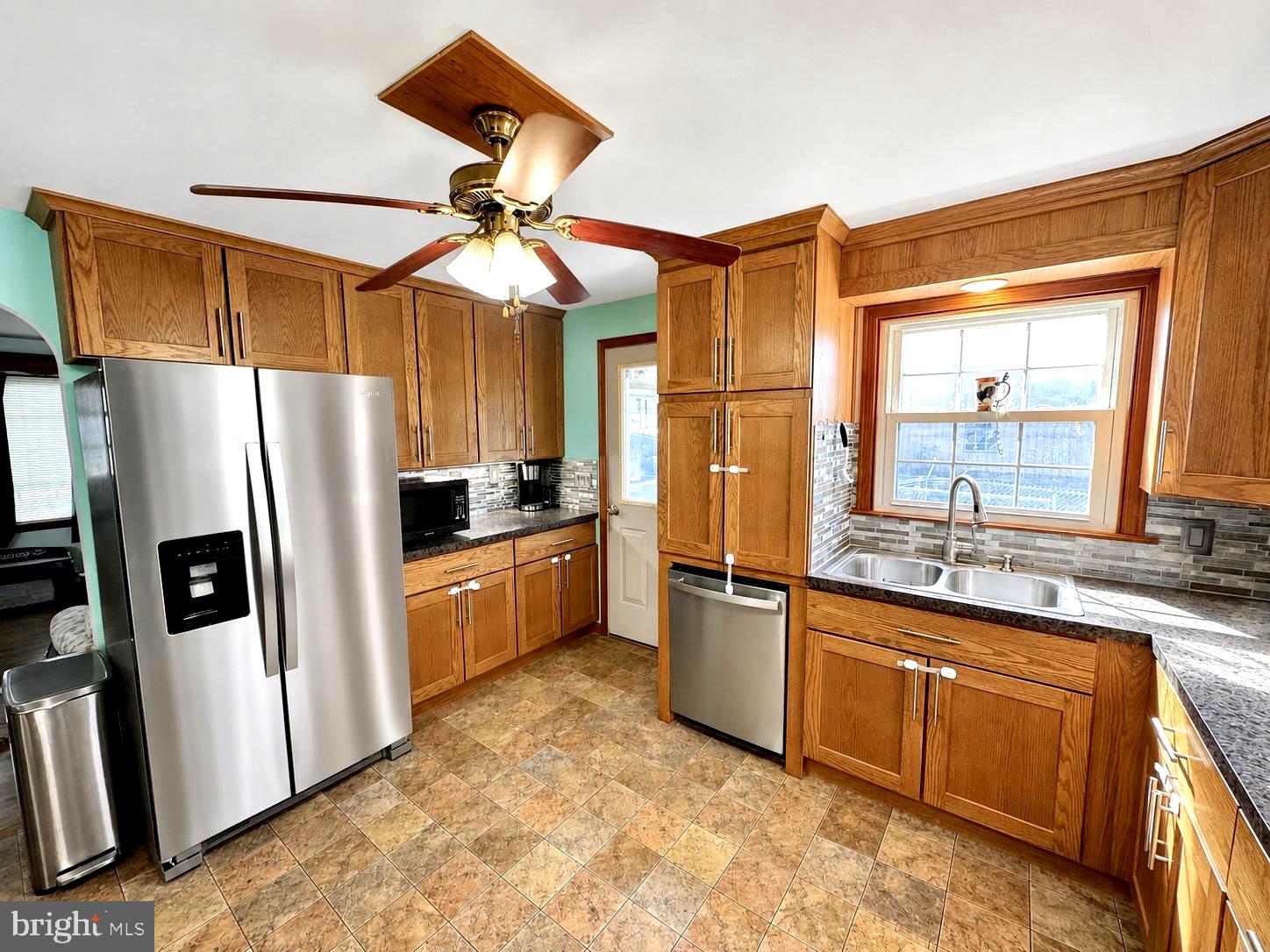 487 Prospect Road Manheim, PA 17545 - Photo 2 of 24 a kitchen with stainless steel appliances granite countertop a refrigerator a sink a stove and island