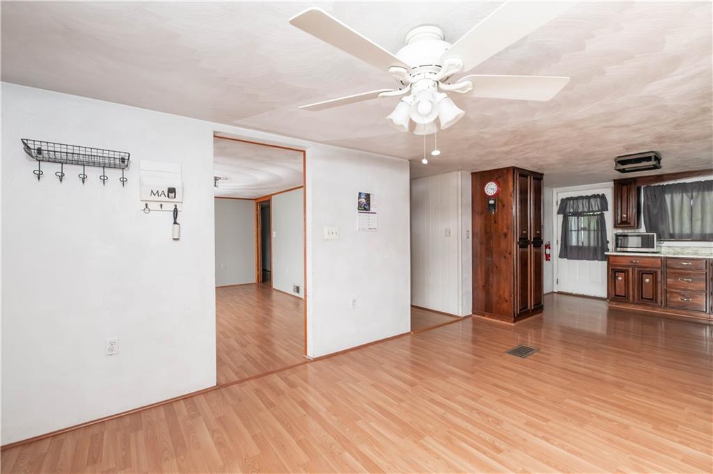105 Dark Hollow Road Indiana, PA 15701 - Photo 27 of 44 a view of an empty room with window and wooden floor