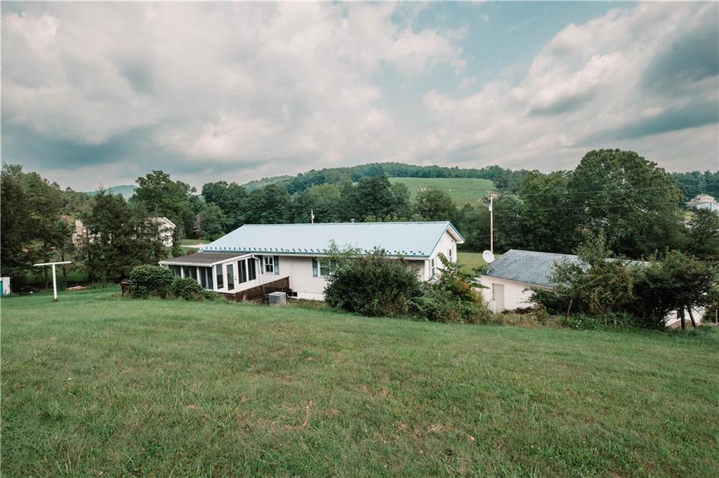 105 Dark Hollow Road Indiana, PA 15701 - Photo 3 of 44 a view of a house with a yard and sitting area