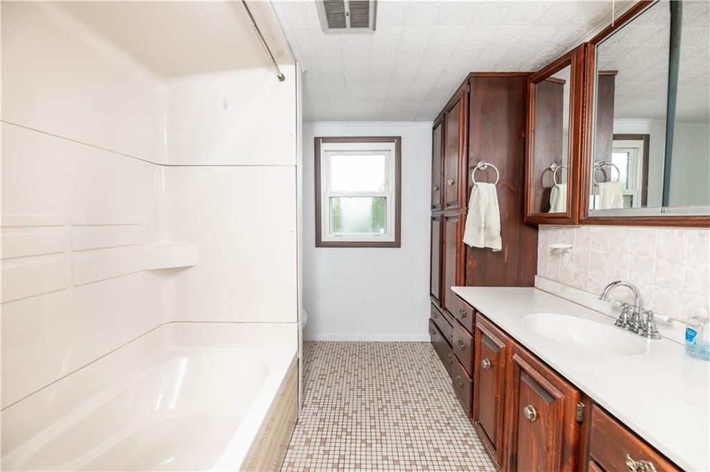 105 Dark Hollow Road Indiana, PA 15701 - Photo 38 of 44 a bathroom with a sink and a mirror