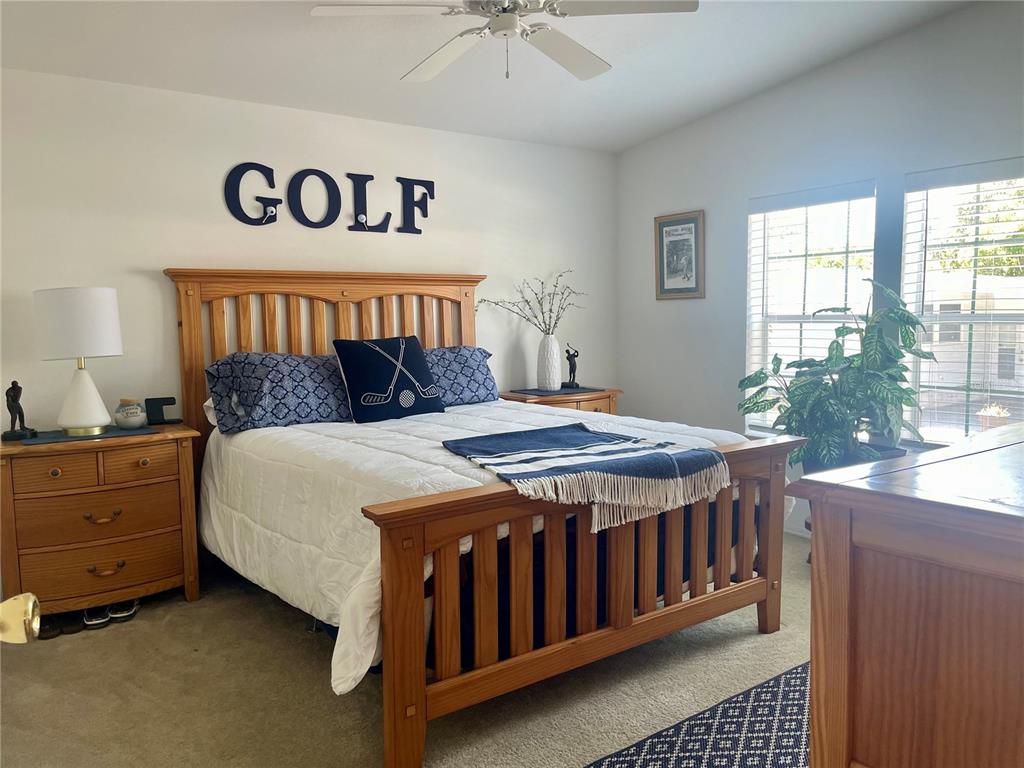 11200 Walsingham Road, Unit 139 Largo, FL 33778 - Photo 7 of 13 a bed sitting in a bedroom next to a window