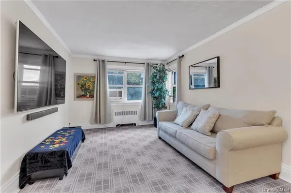 a living room with furniture and a window