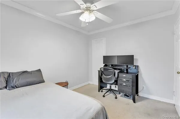 a bedroom with a bed and a chair