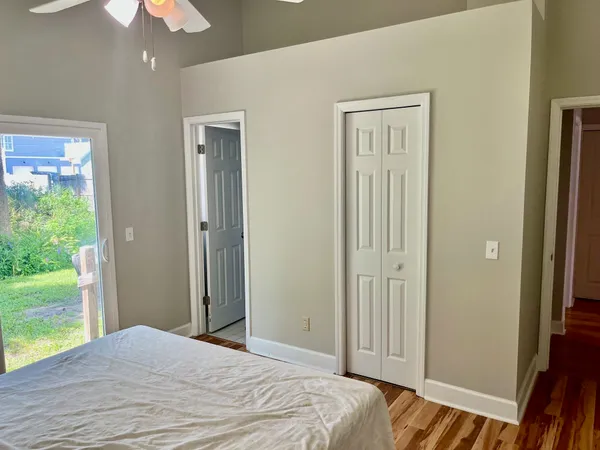 a bedroom with a bed and a chandelier