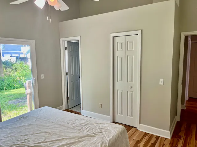 a bedroom with a bed and a chandelier