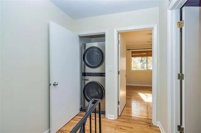 a view of a hallway with washer and dryer