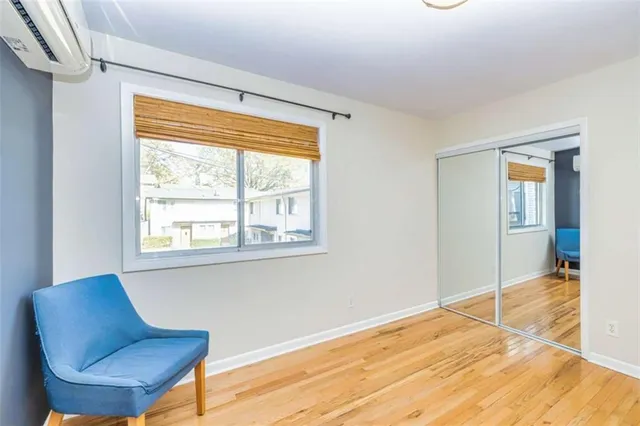 a view of an empty room with glass door and glass door