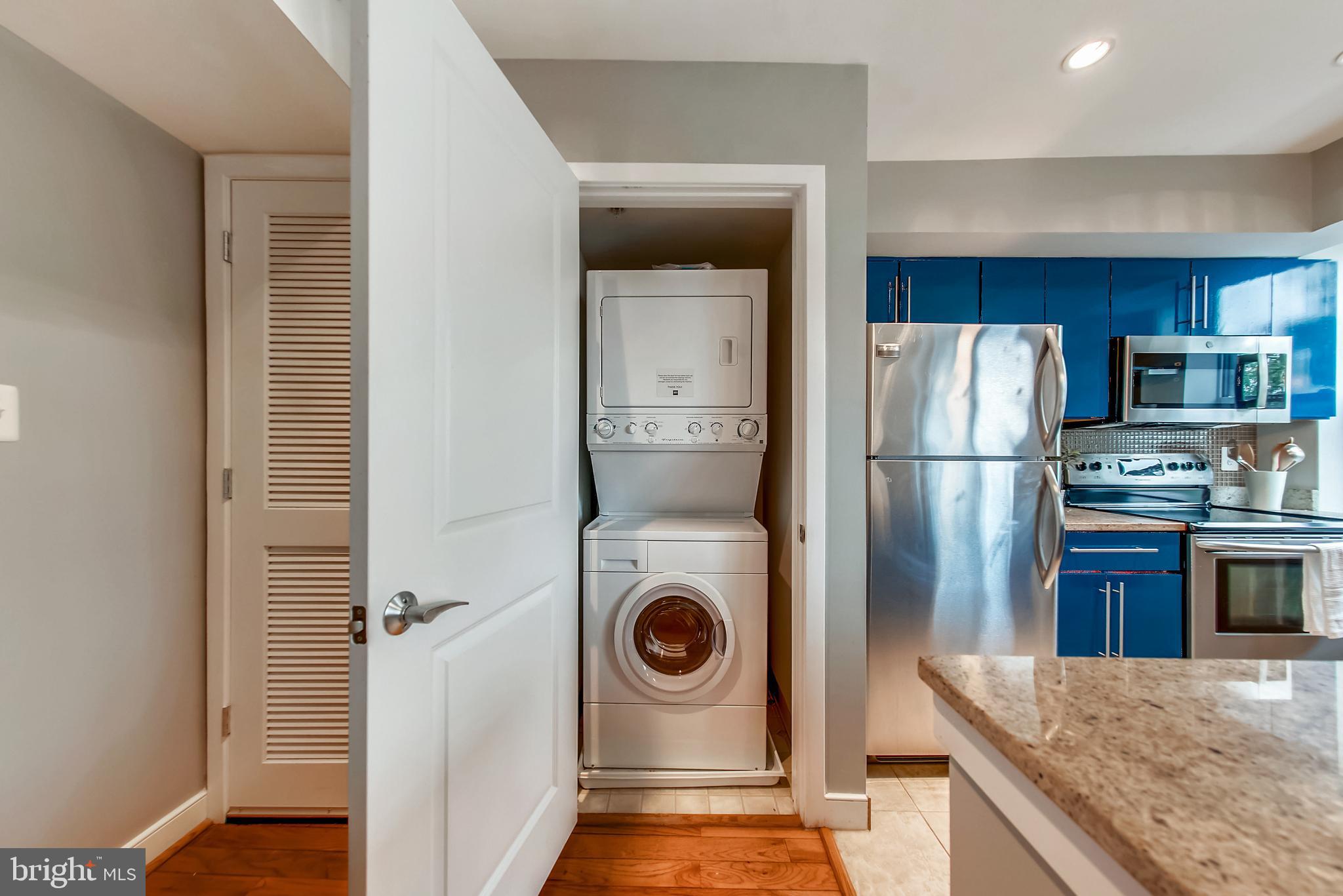 420 16th Street Southeast, Unit 306 Washington, DC 20003 - Photo 16 of 32 a kitchen with refrigerator and washer