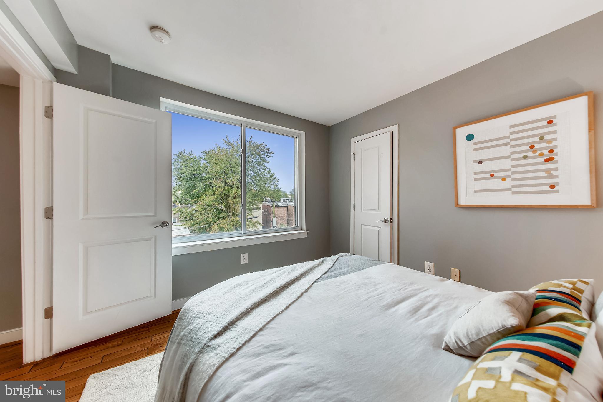 420 16th Street Southeast, Unit 306 Washington, DC 20003 - Photo 21 of 32 a bedroom with a bed and a window
