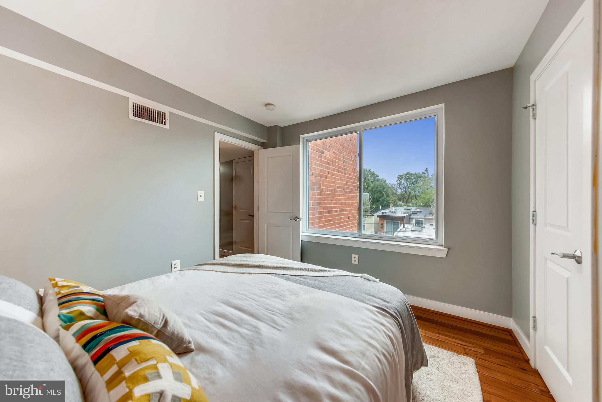 420 16th Street Southeast, Unit 306 Washington, DC 20003 - Photo 22 of 32 a bedroom with a bed and a window