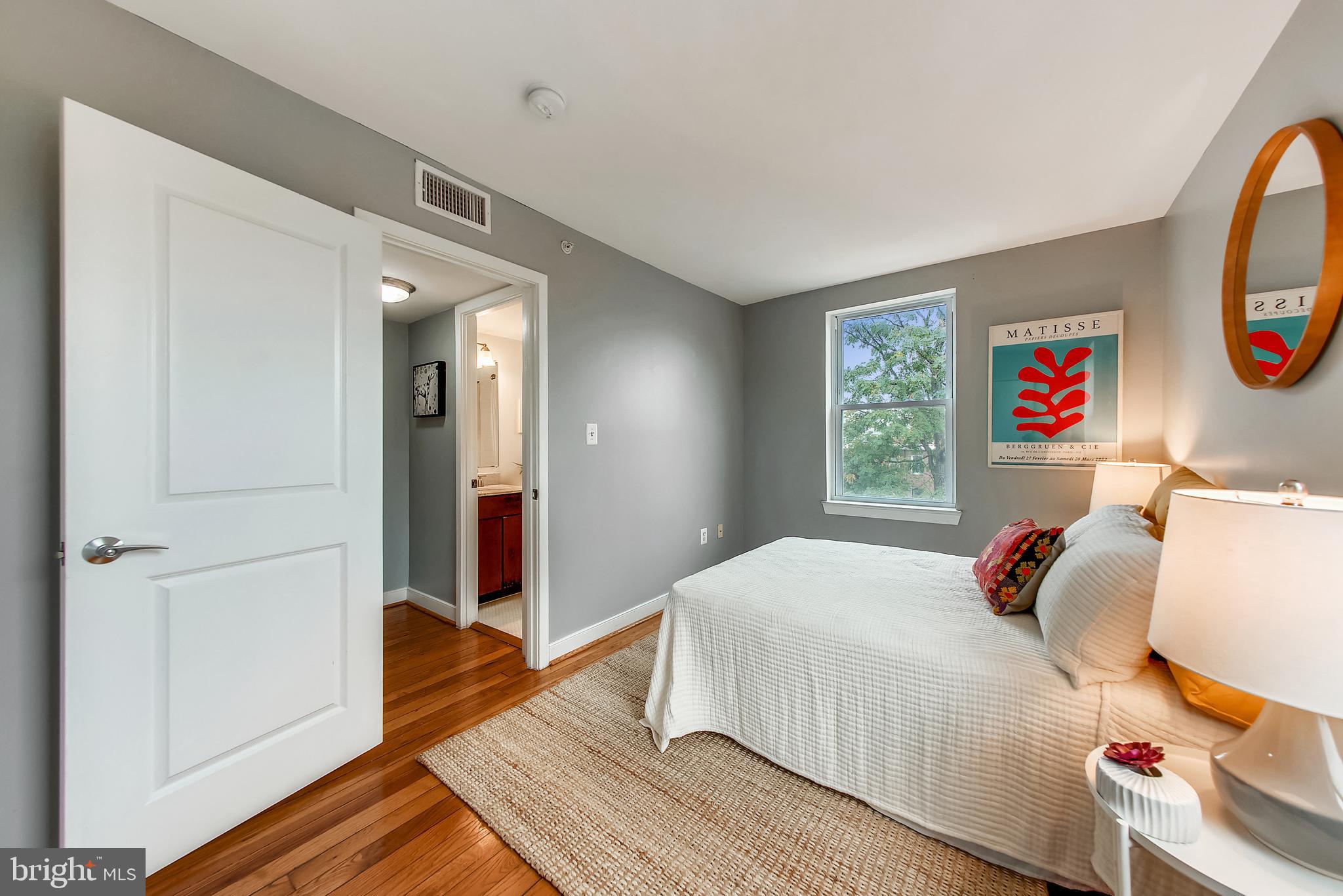 420 16th Street Southeast, Unit 306 Washington, DC 20003 - Photo 27 of 32 a bedroom with a bed and a dresser