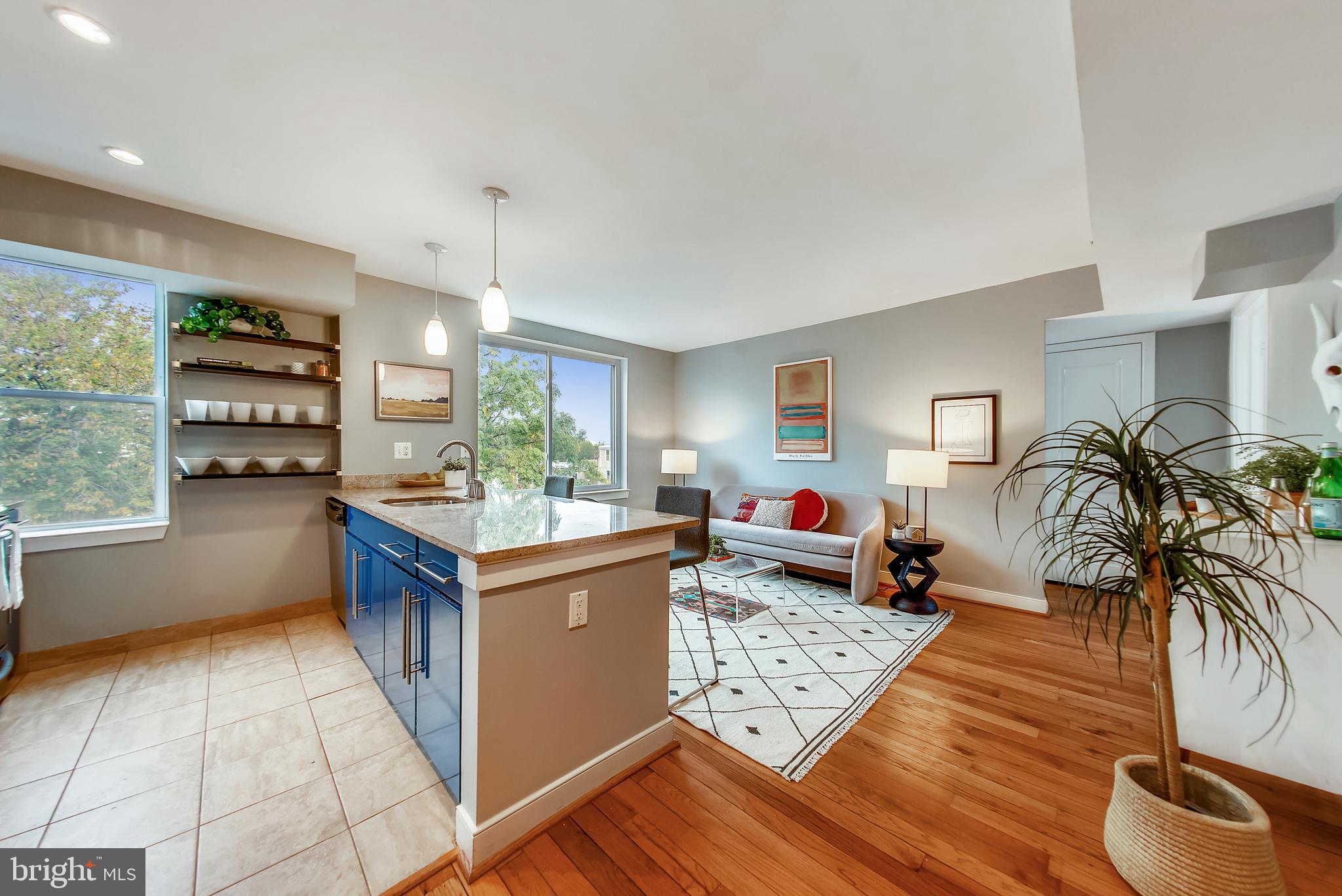 420 16th Street Southeast, Unit 306 Washington, DC 20003 - Photo 4 of 32 a kitchen with stainless steel appliances granite countertop a stove a sink and a refrigerator
