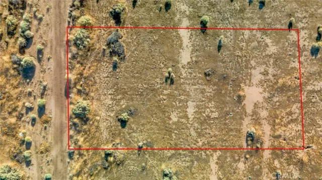 an aerial view of a house with a lake view
