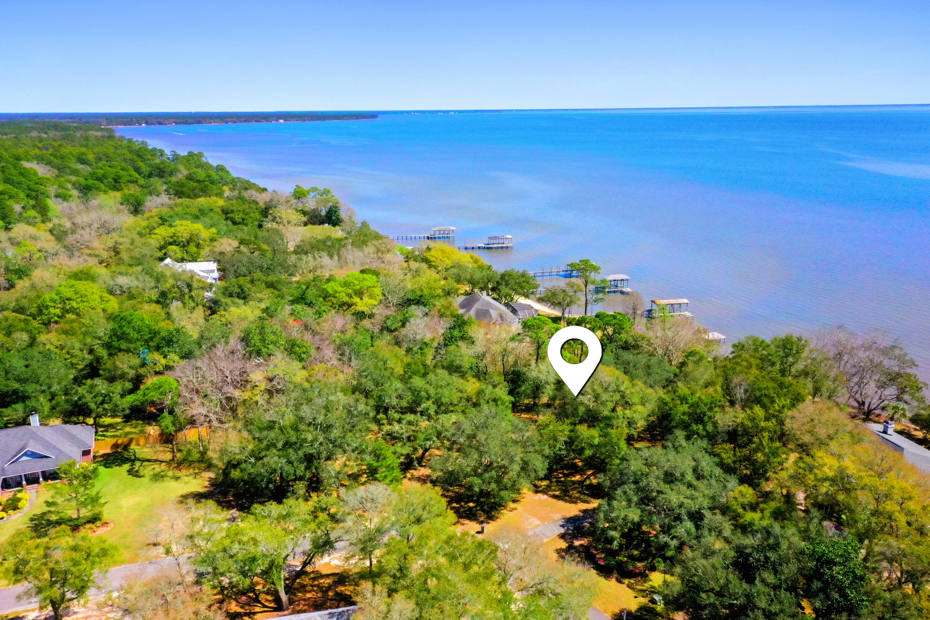 Lot 9 Cedar Beach Cove Freeport, FL 32439 - Photo 13 of 41 a backyard of a house with lots of green space and garden