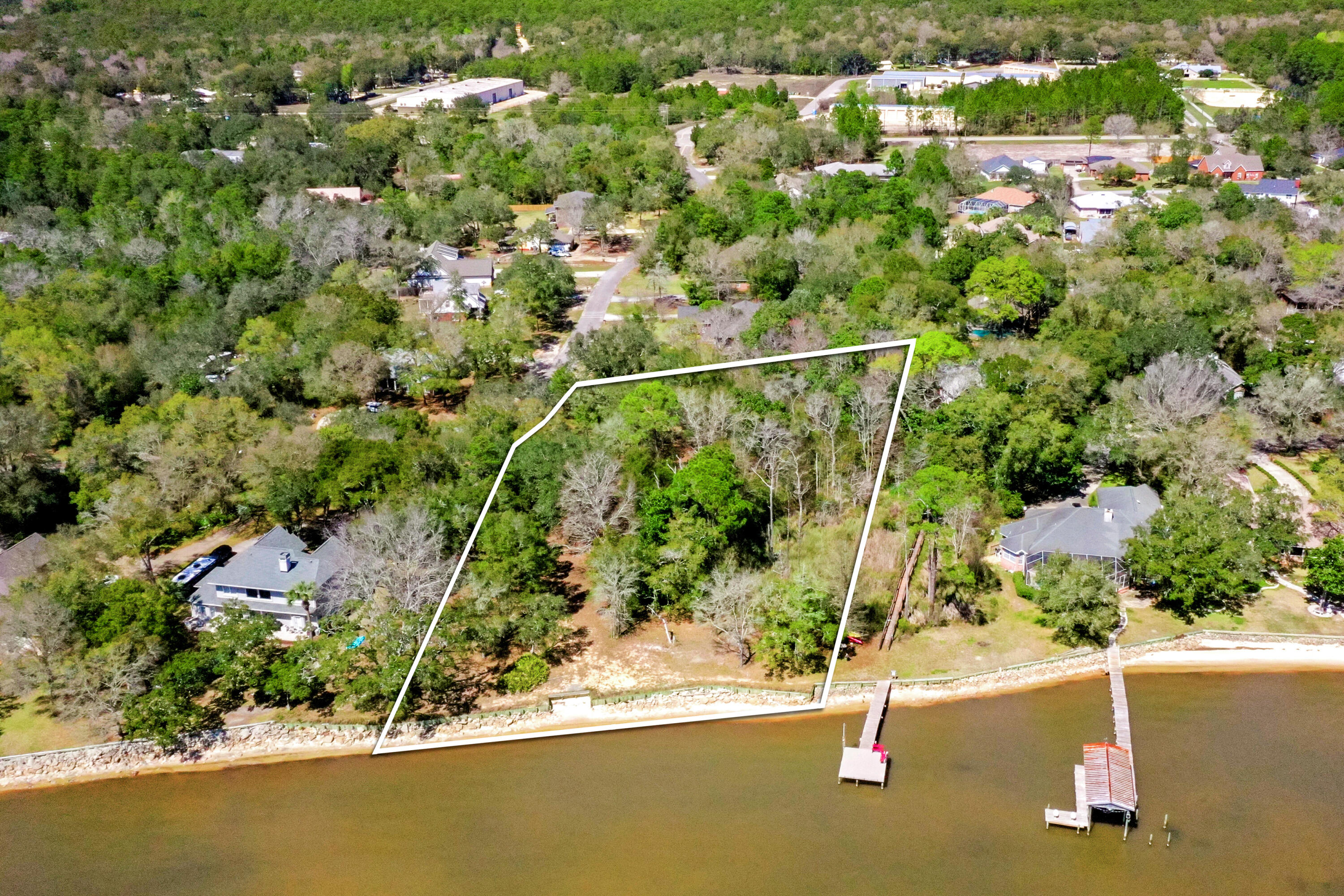 Lot 9 Cedar Beach Cove Freeport, FL 32439 - Photo 9 of 41 an aerial view of a house with a yard and lake view
