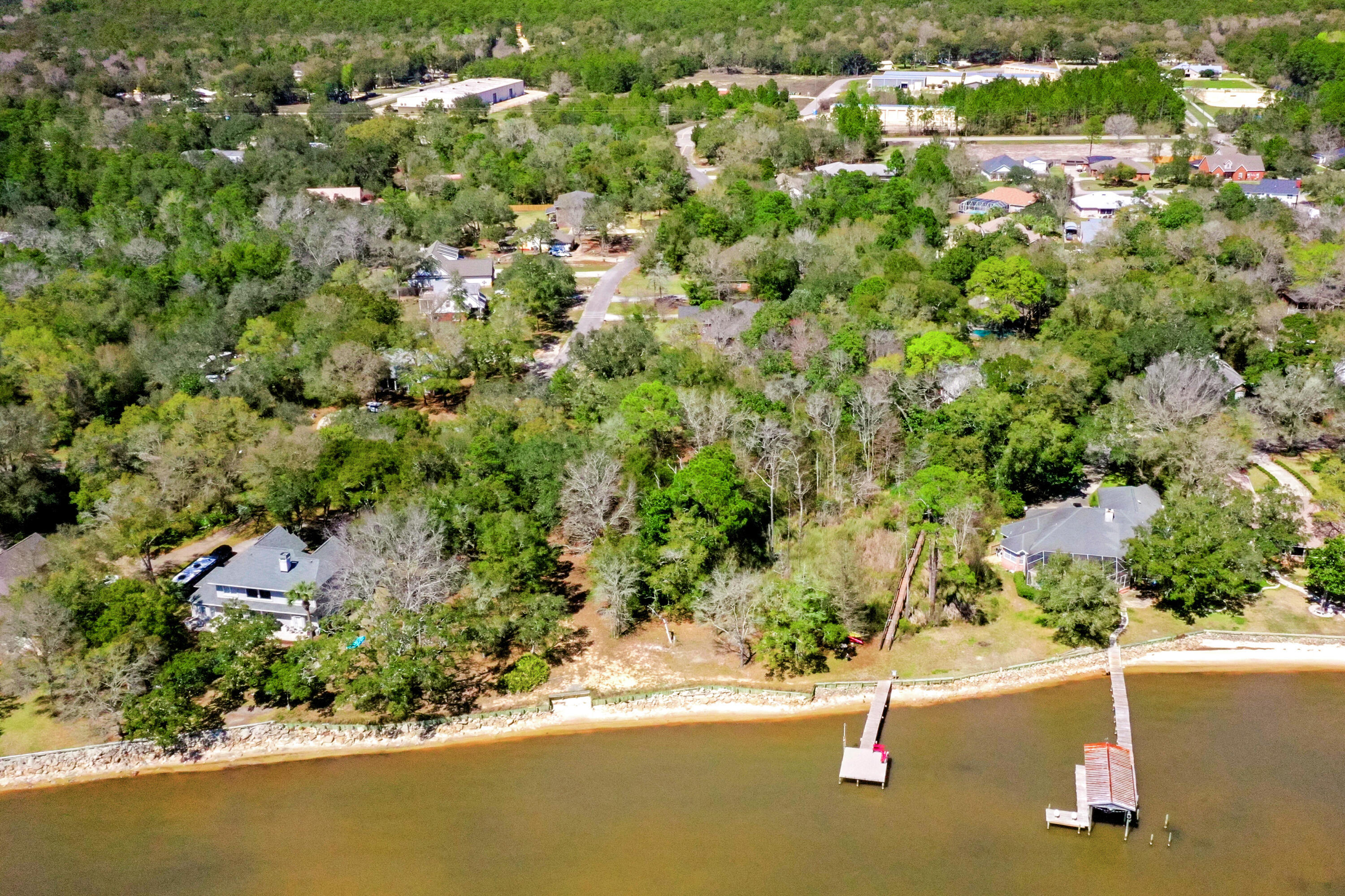 Lot 9 Cedar Beach Cove Freeport, FL 32439 - Photo 10 of 41 an aerial view of a house with a yard and lake view
