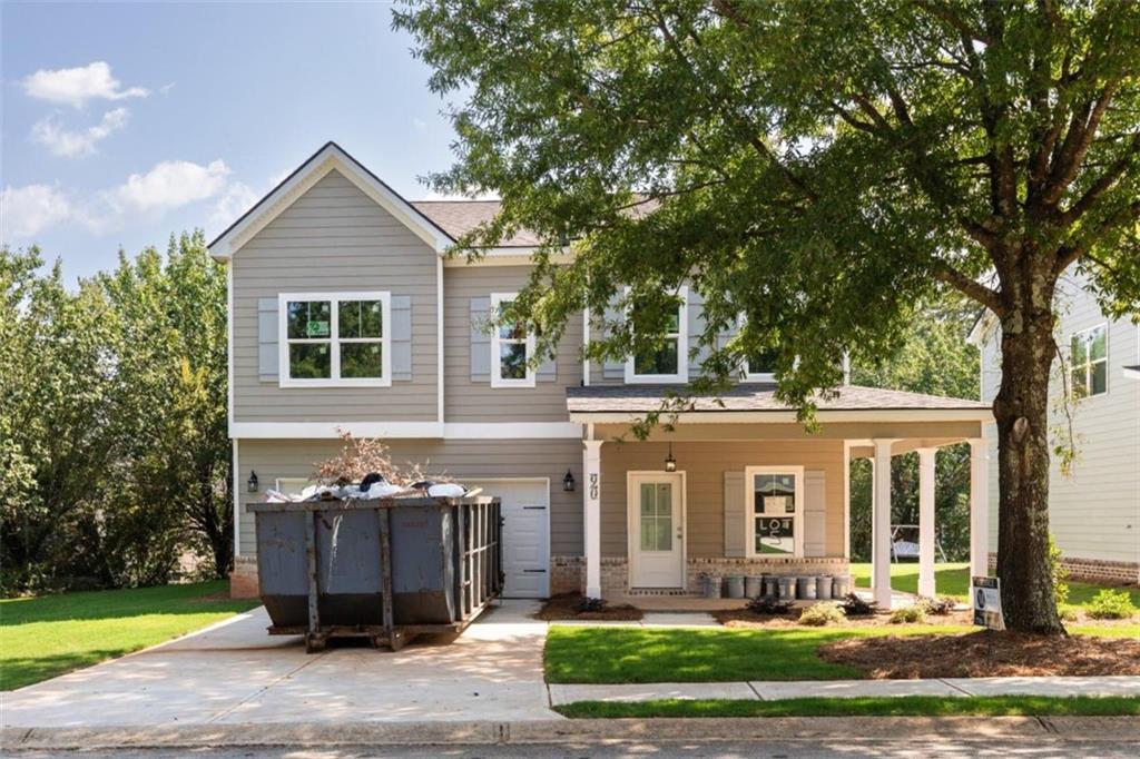 90 Ryan Lane Covington, GA 30014 - Photo 1 of 1 a front view of a house with garden
