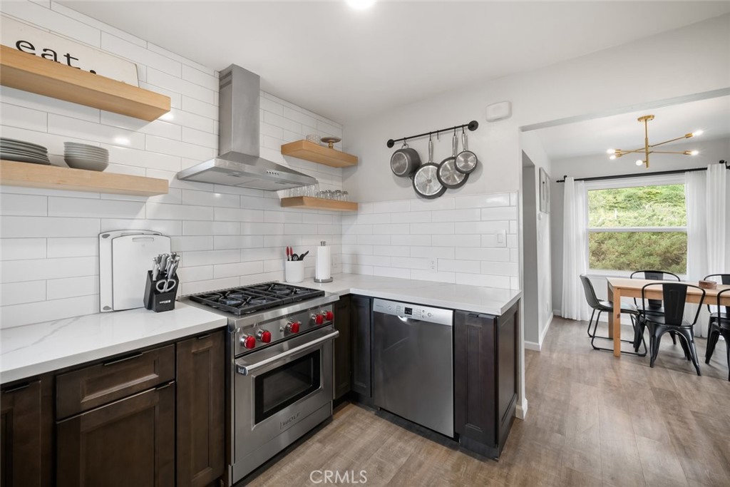 104 16th Street Paso Robles, CA 93446 - Photo 11 of 40 a kitchen with a stove and wooden floor