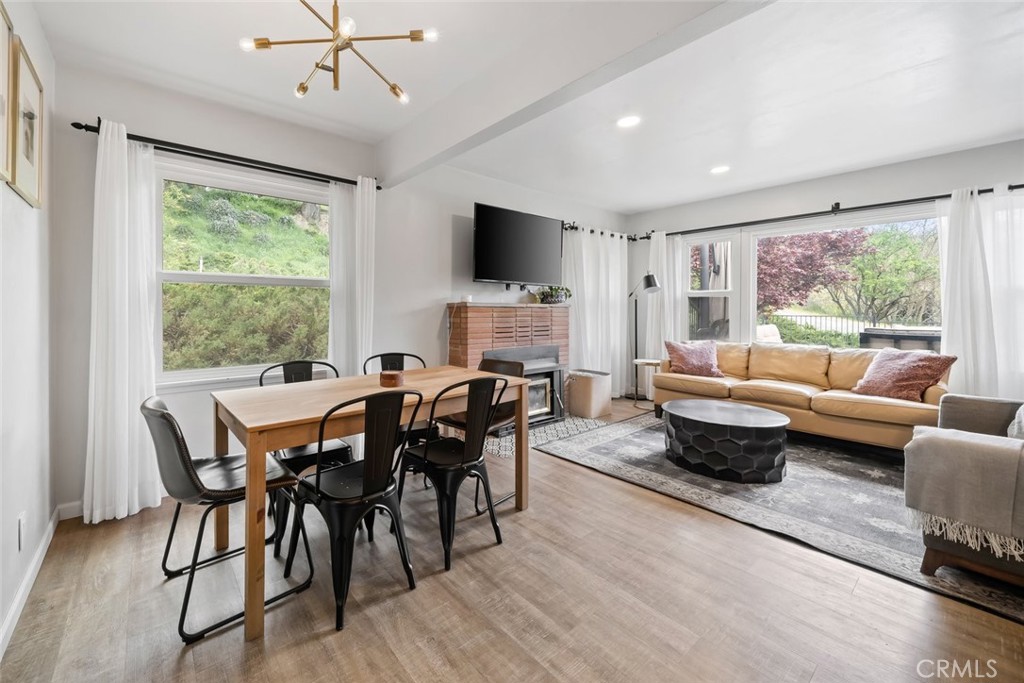 104 16th Street Paso Robles, CA 93446 - Photo 13 of 40 a living room with furniture a flat screen tv and a large window
