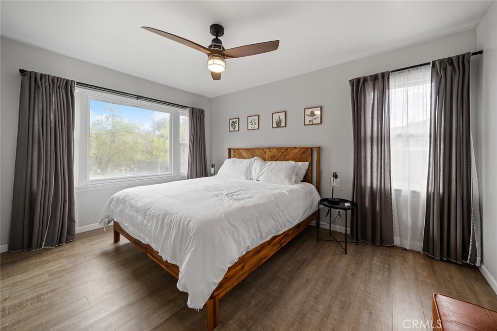 104 16th Street Paso Robles, CA 93446 - Photo 14 of 40 a bedroom with a large bed and a large window