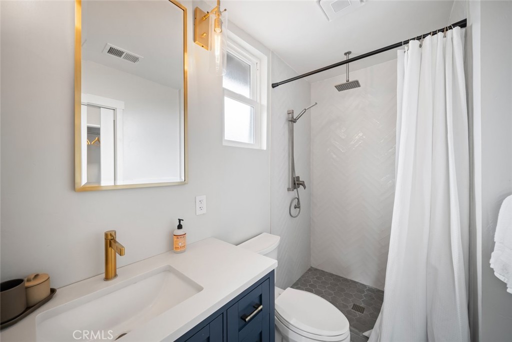 104 16th Street Paso Robles, CA 93446 - Photo 17 of 40 a bathroom with a sink toilet and shower