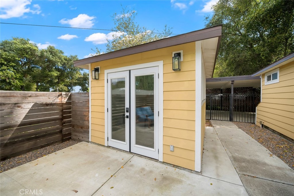 104 16th Street Paso Robles, CA 93446 - Photo 33 of 40 a view of a house with backyard and wooden fence