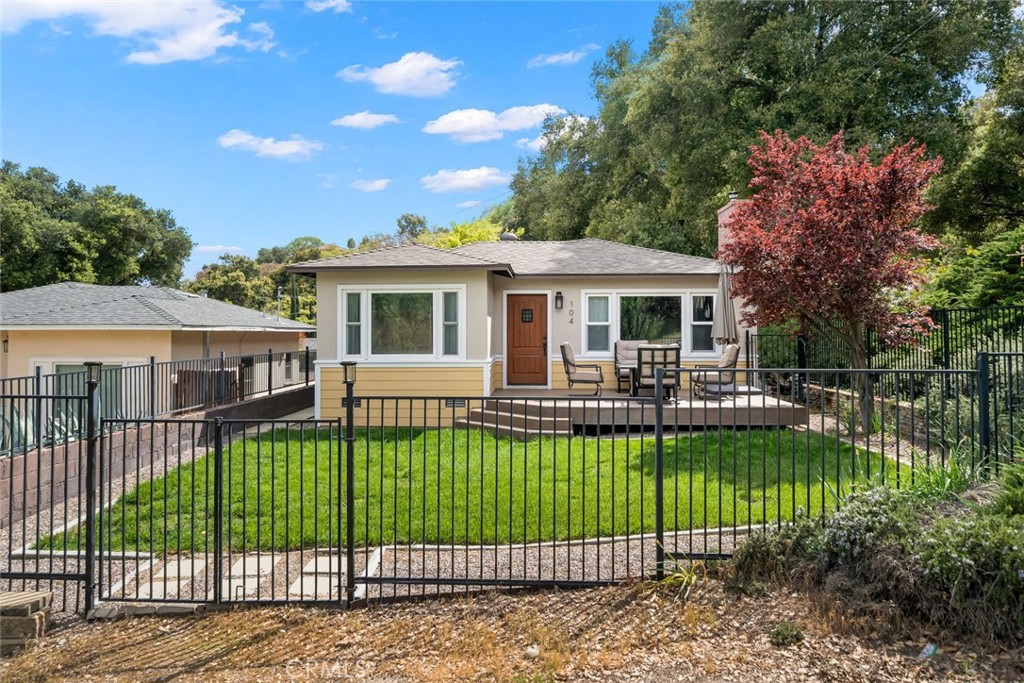 104 16th Street Paso Robles, CA 93446 - Photo 40 of 40 a view of a house with a yard table and chairs