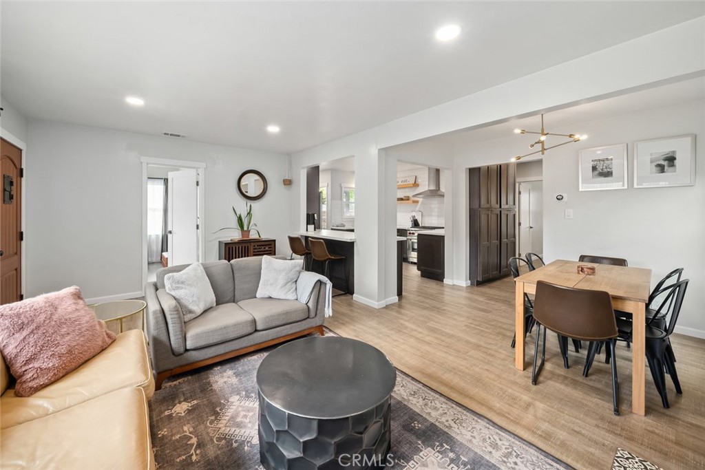 104 16th Street Paso Robles, CA 93446 - Photo 8 of 40 a living room with furniture and a dining table with wooden floor