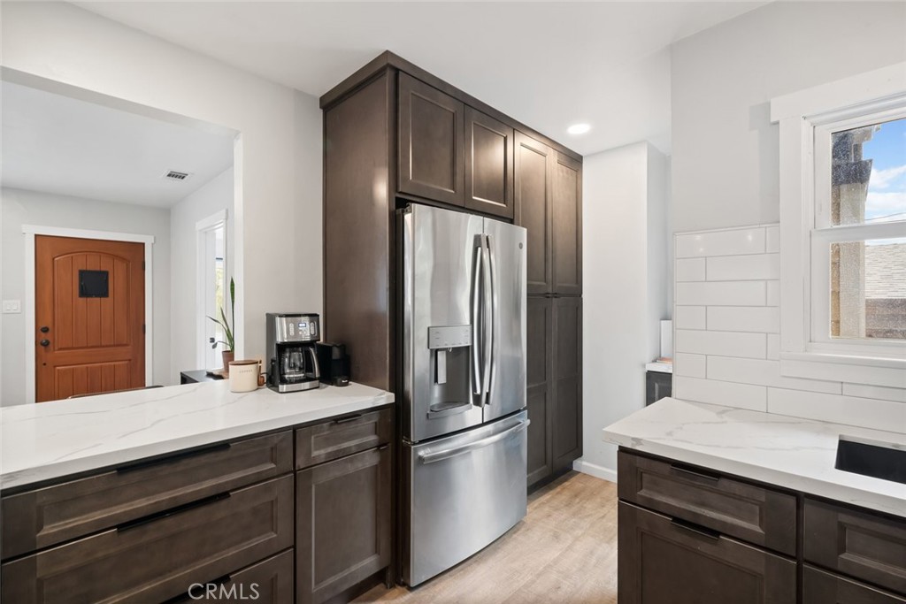 104 16th Street Paso Robles, CA 93446 - Photo 10 of 40 a kitchen with stainless steel appliances a refrigerator and a sink
