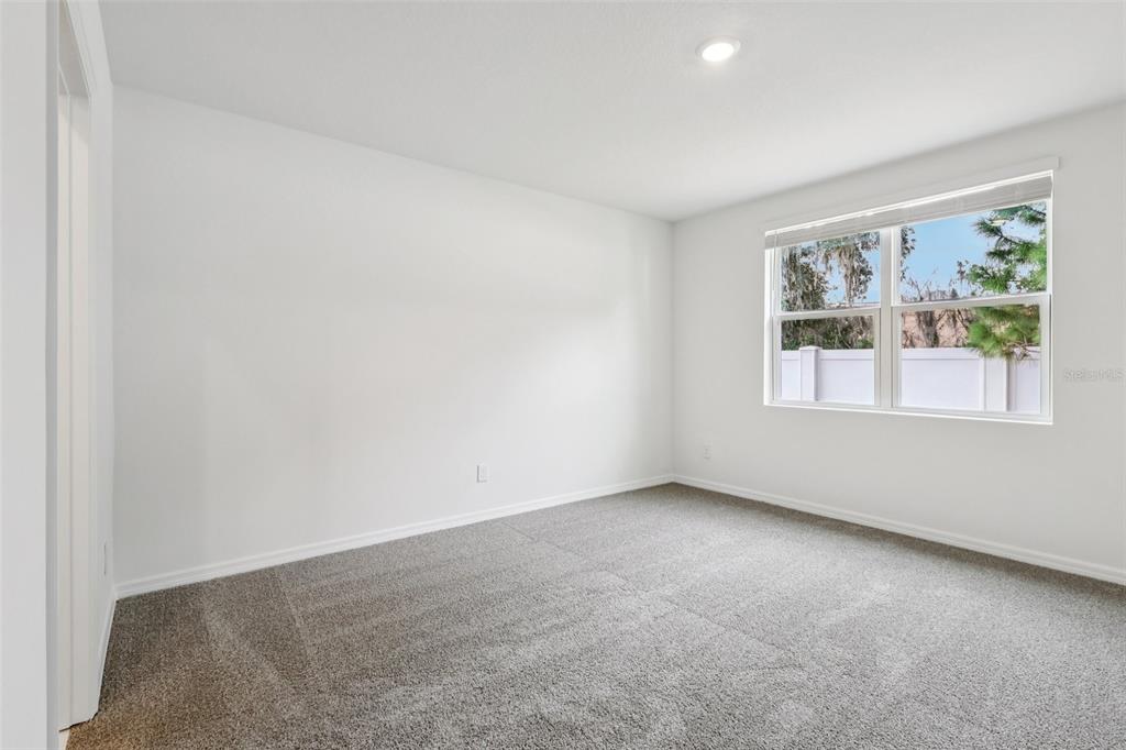 28009 Poppy Court Leesburg, FL 34748 - Photo 18 of 35 an empty room with windows