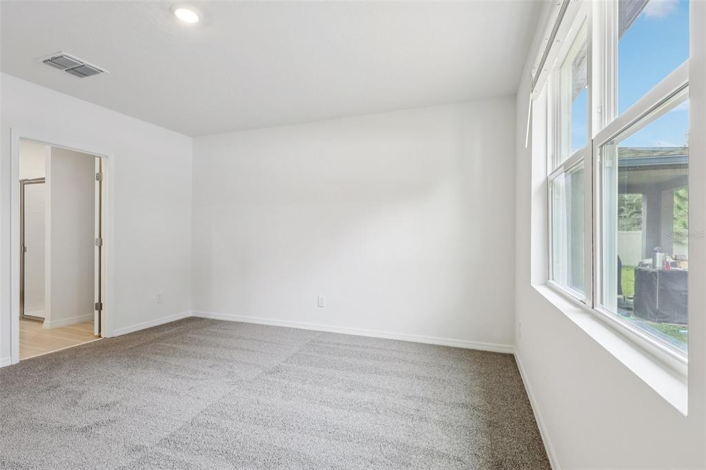 28009 Poppy Court Leesburg, FL 34748 - Photo 19 of 35 a view of an empty room with a window