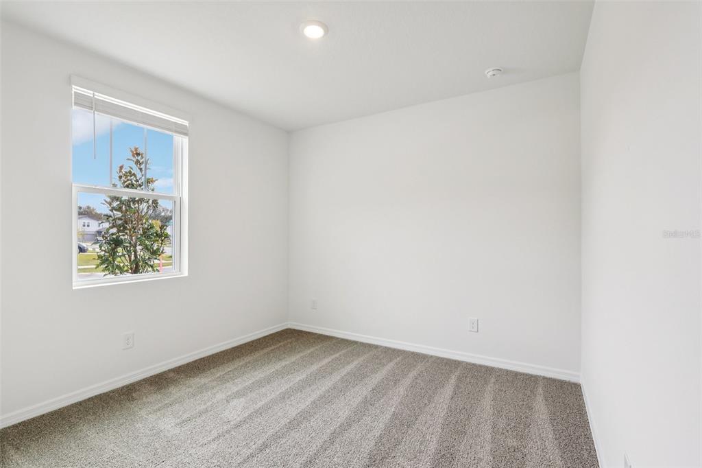 28009 Poppy Court Leesburg, FL 34748 - Photo 23 of 35 an empty room with a window