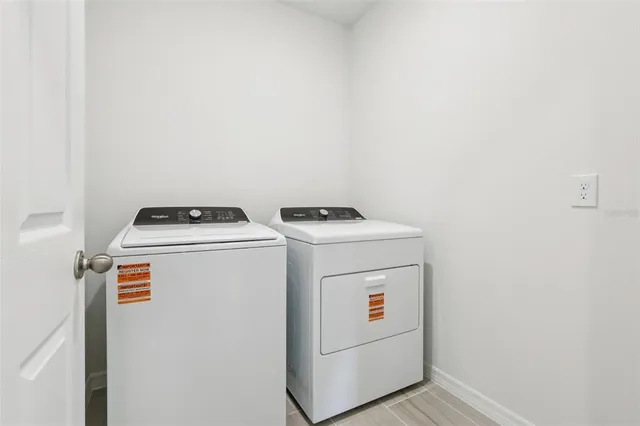 a utility room with dryer and washer
