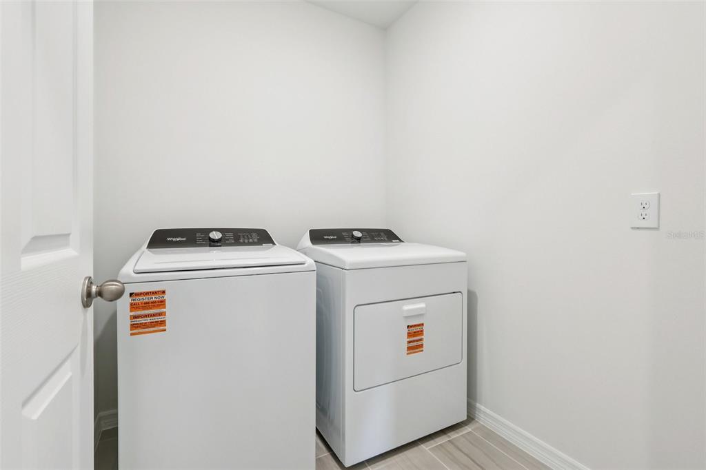 28009 Poppy Court Leesburg, FL 34748 - Photo 28 of 35 a utility room with dryer and washer