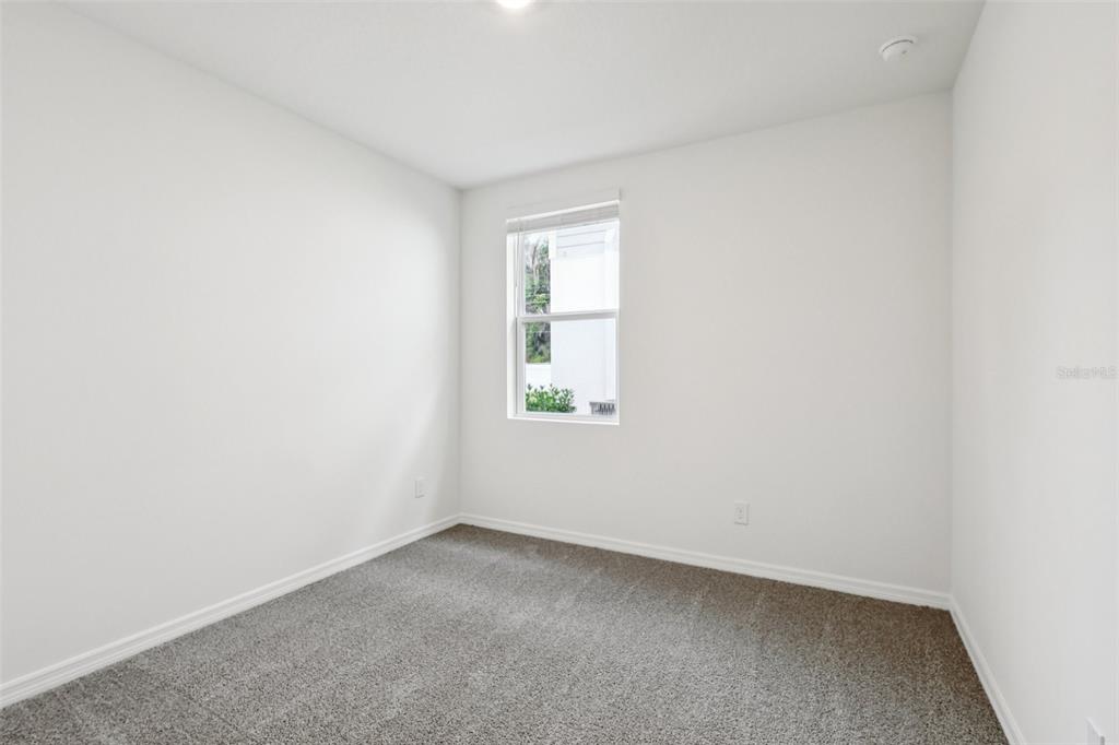 28009 Poppy Court Leesburg, FL 34748 - Photo 29 of 35 an empty room with a window