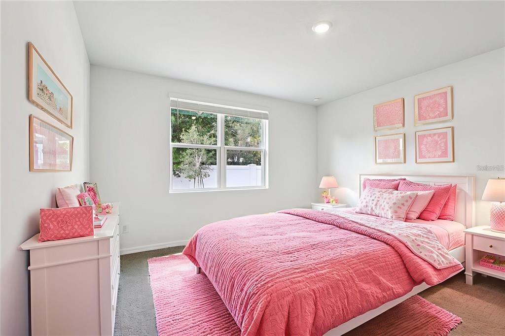 28009 Poppy Court Leesburg, FL 34748 - Photo 6 of 35 a bedroom with a bed and a window