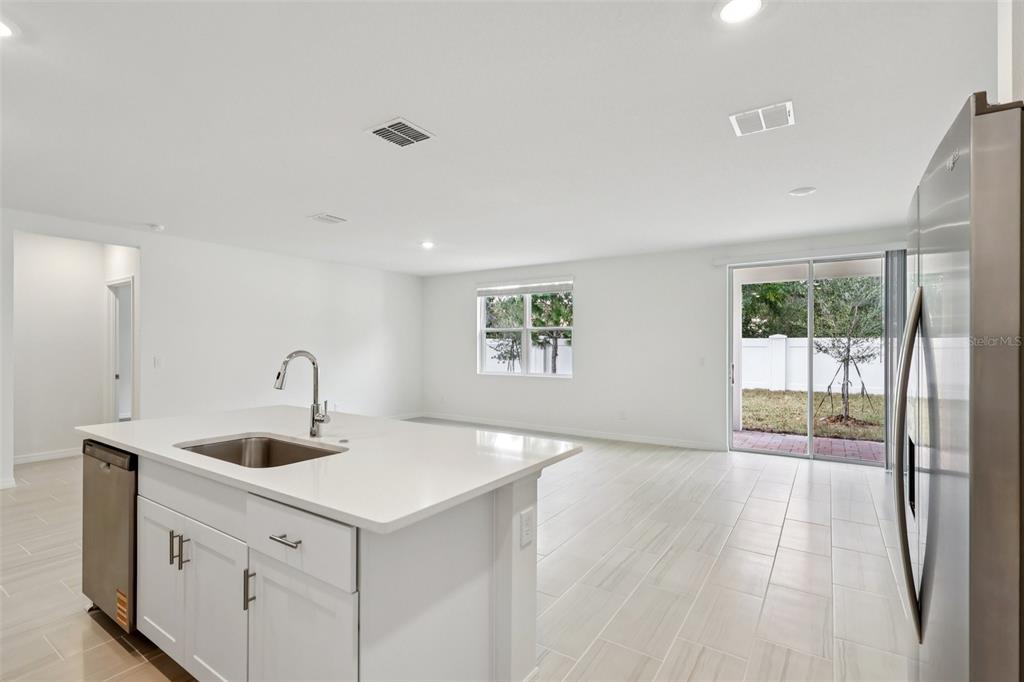 28009 Poppy Court Leesburg, FL 34748 - Photo 8 of 35 a kitchen with a sink and large window